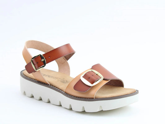 Discover womens premium sandals featuring a vegan-friendly design, complete with chunky white soles, tan and brown leather straps with gold buckles, and a zigzag tread pattern for added flair.