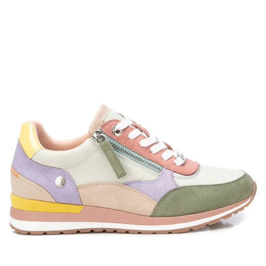 A multicoloured vegan trainer for women in pastel shades of green, lavender, pink and yellow, featuring white laces, a side zip, and a rubber sole.