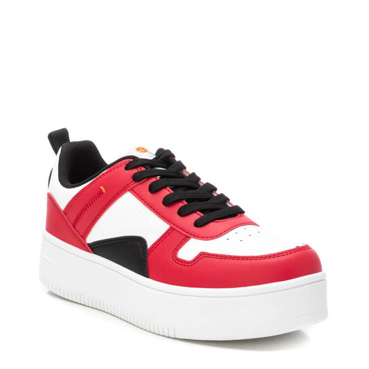 A low-top women’s trainer with a white sole, red and white upper panels, black laces, and black accent detailing—crafted as cruelty-free, vegan trainers for considered style.