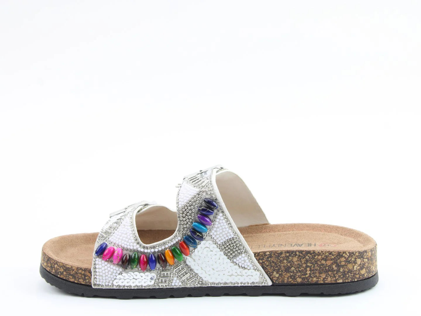 A silver slip-on sandal with a cork sole, textured upper, and multicoloured bead embellishments on the strap, crafted from vegan-friendly materials—perfect for your summer look. Shown against a white background.