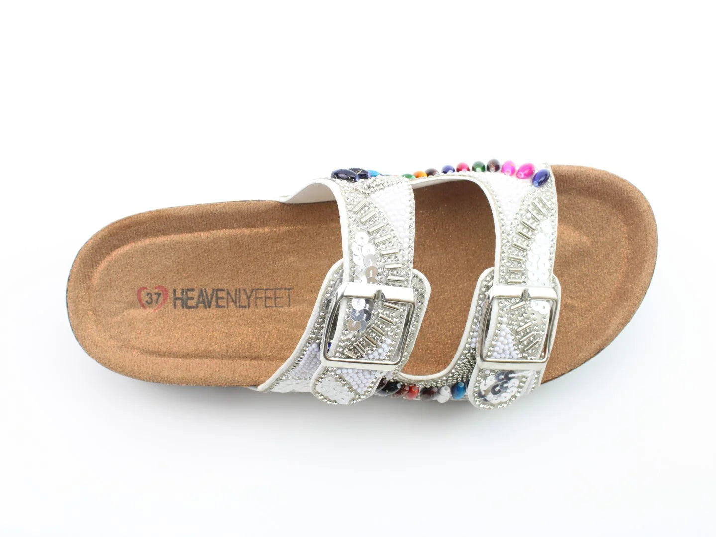 A white sandal with two buckle straps—embellished with colourful beads and silver details—crafted from vegan-friendly materials, perfect for an effortless summer look.