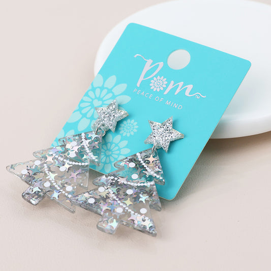 A pair of glittery acrylic Christmas tree earrings with star tops, displayed on a blue “Peace of Mind” card, ideal for adding festive charm to your holiday jewellery collection.