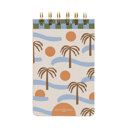 An elegant piece of stationery, this Palm Tree Note Pad has a spiral binding and a tropical cover adorned with palm trees, orange circles, and blue wavy lines on a cream-coloured background.