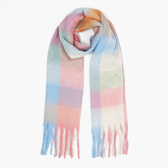 A vegan scarf with pastel-coloured stripes in light blue, pink, peach, and light green, featuring fringed ends, laid flat on a white background—ideal for those seeking animal-friendly accessories.
