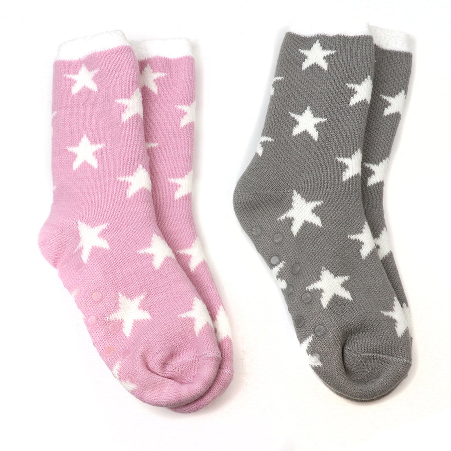 Two pairs of cosy socks, one pink and one grey with white stars, are placed side by side on a white background. These vegan socks are ideal for keeping your feet warm and stylish.