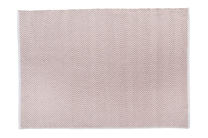 Experience the vibrant allure of a rectangular rug featuring a pink and white zigzag pattern on a plain white background. Crafted as a Herringbone Recycled Plastic Bottles Rug, it embodies sustainable elegance for your home.