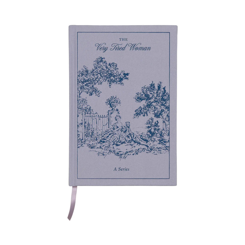 A vintage journal with lay-flat binding, depicting women by a garden gate and the words “The Very Tired Woman: A Series” on the lavender-coloured cover.