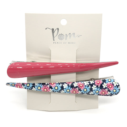 An essential for the fashion connoisseur, this Pink & Blue Floral Hair Clip Duo comprises one solid pink clip and another embellished with vibrant floral prints, adding an elegant touch to any hairstyle.