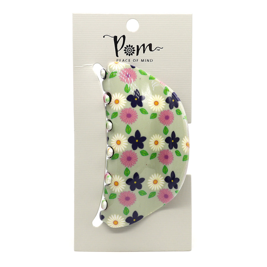Elegant floral-patterned acrylic claw clip in green on a white card with the brand name POM Peace of Mind, perfect for the fashion-conscious individual.