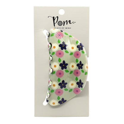 Elegant floral-patterned acrylic claw clip in green on a white card with the brand name POM Peace of Mind, perfect for the fashion-conscious individual.