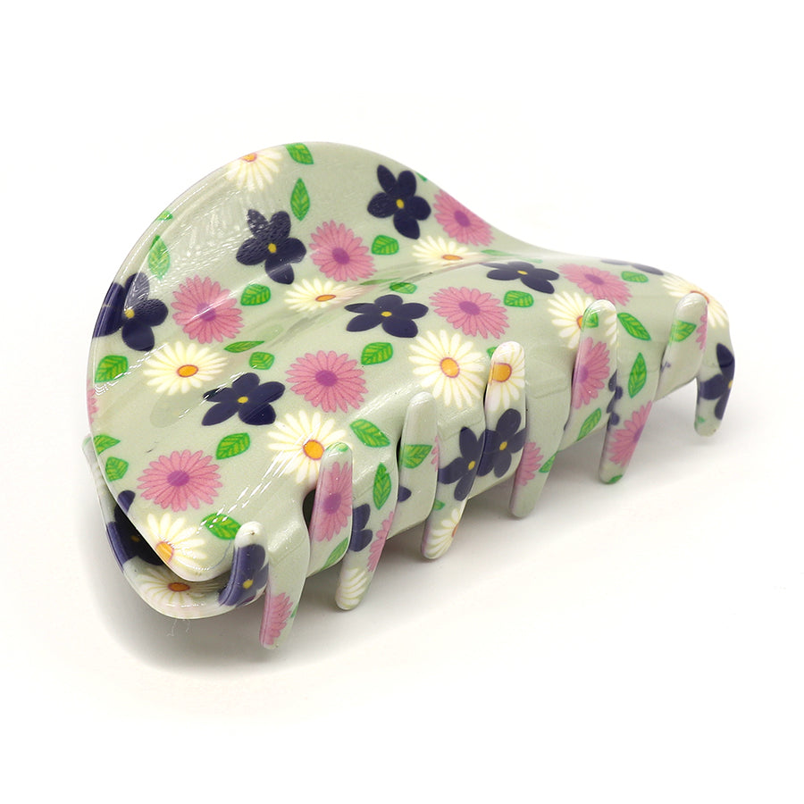 Acrylic floral claw clip with a fashion-forward design, featuring pink, purple, and white flowers on a pale background.