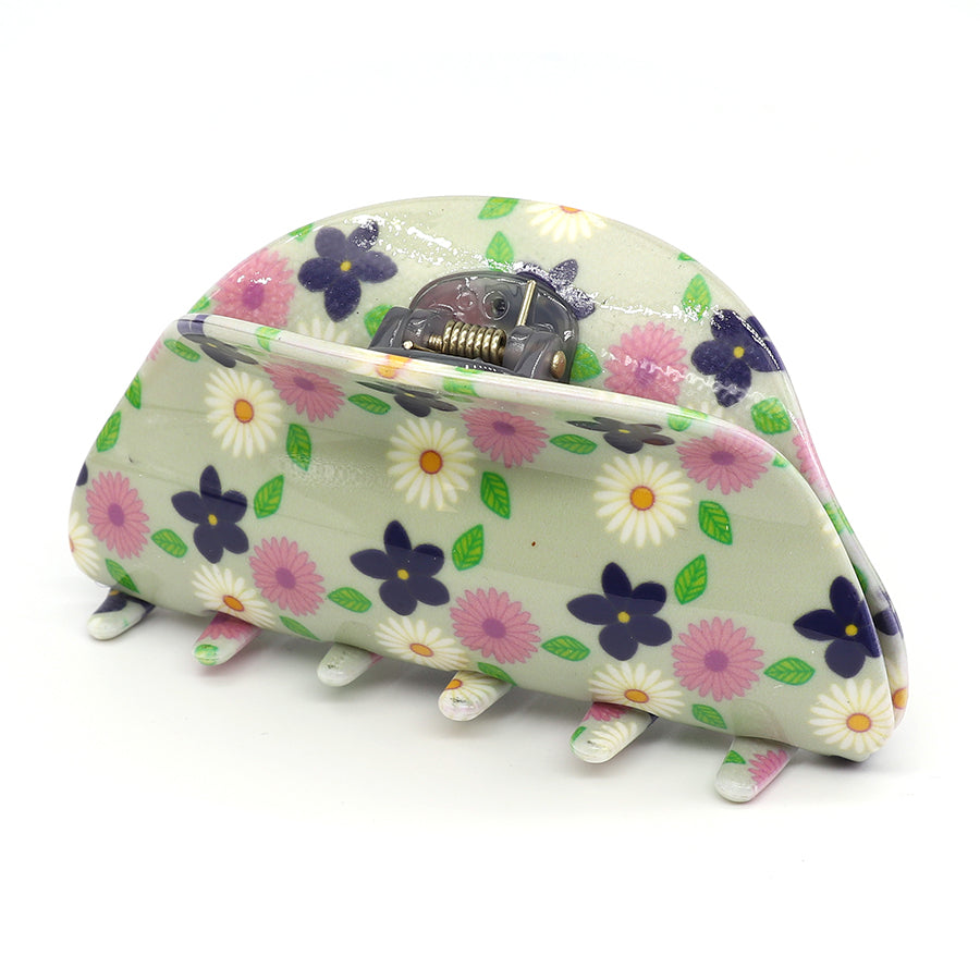 Discover elegance with our fashion-forward acrylic floral claw clip, featuring a beautiful blend of white, pink, and purple flowers on a light green background.