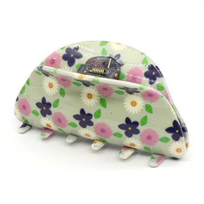 Discover elegance with our fashion-forward acrylic floral claw clip, featuring a beautiful blend of white, pink, and purple flowers on a light green background.