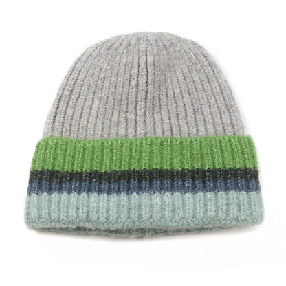 A ribbed beanie hat with a grey top and a folded brim in green, black, blue, and light blue stripes—this colourful beanie is the perfect warm knitted hat for chilly days.