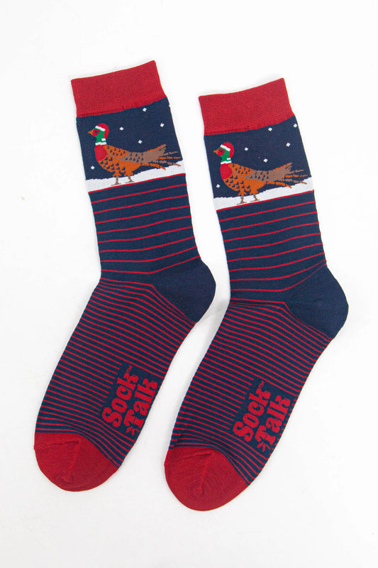 A pair of navy and red men's Pheasant Vegan Socks featuring a pheasant and snow motif on the upper section, with 'Sock Talk' text on the soles.