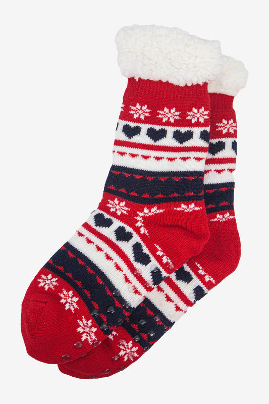A pair of red and white festive socks featuring a heart and snowflake pattern, navy blue stripes, and cosy white fleece lining at the tops—perfect fluffy slipper socks for keeping warm in winter.