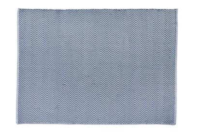 A square blue mat featuring a chevron pattern on a white background, crafted from recycled plastic bottles for a sustainable touch.