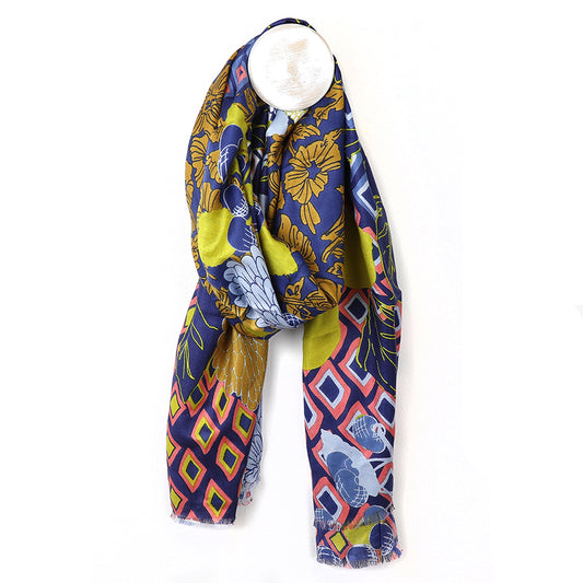 Colourful Bamboo Scarf with Dahlia Multi Print, featuring floral and geometric patterns in blue, yellow, and red. Displayed elegantly on a white mannequin neck.