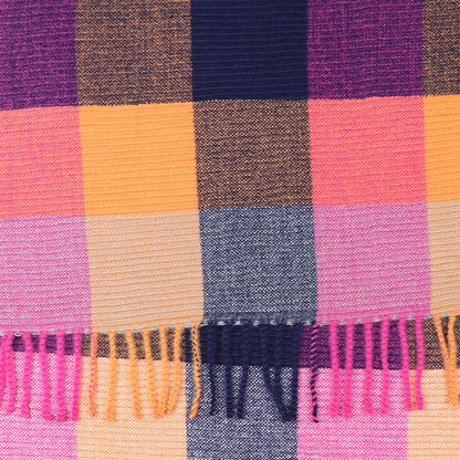 Close-up of a woven crinkle check scarf in navy blue, orange, pink, and purple with fringed tassels—ideal as a stylish accessory for any outfit.