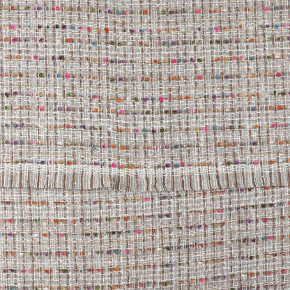 Close-up of a grey woven-texture scarf with a grid pattern, featuring multicoloured threads—pink, orange, green and purple—and a horizontal seam across the middle; a cosy winter accessory.