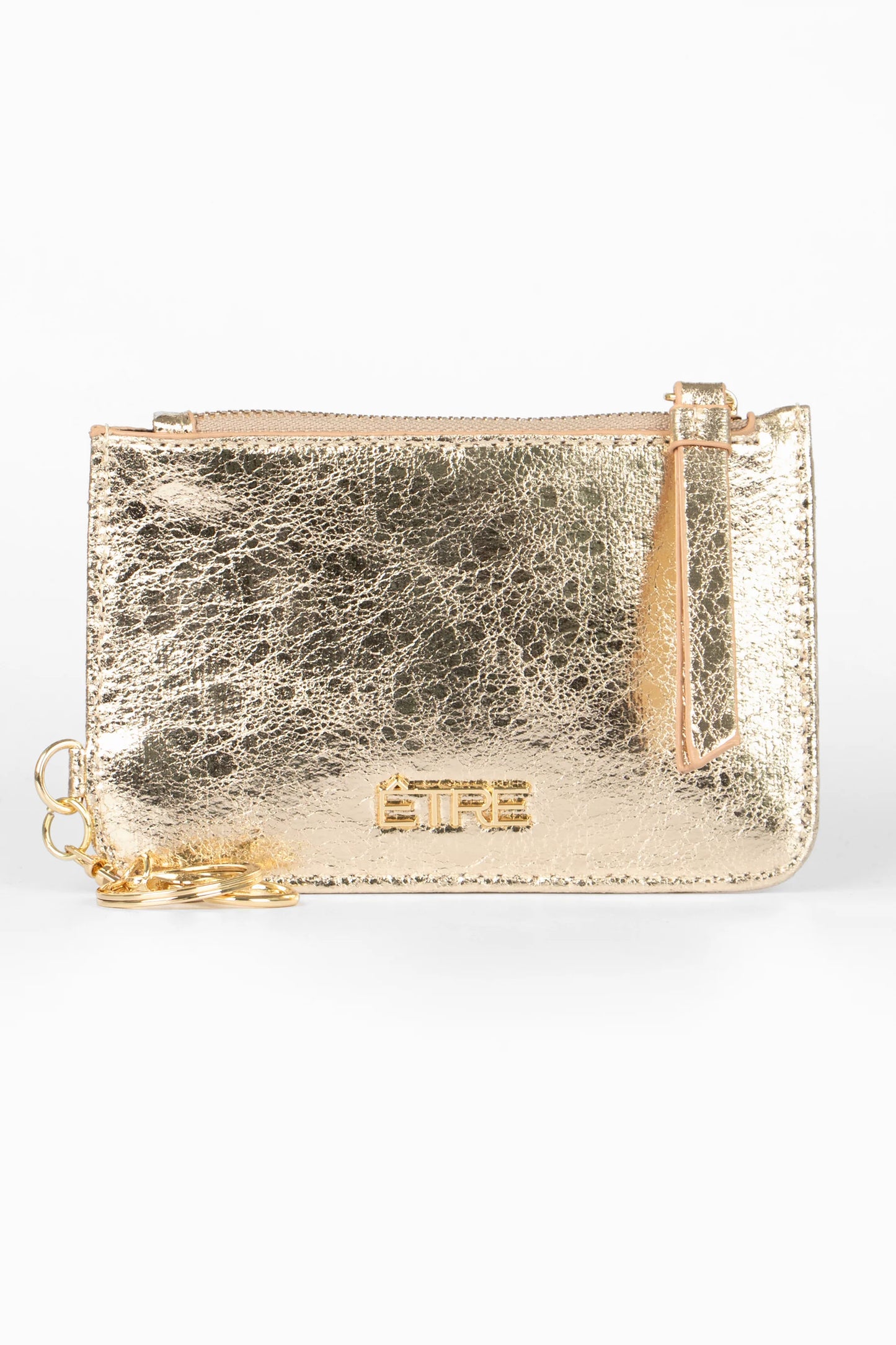 A small metallic gold faux leather zipped pouch with a keyring and embossed logo on the front, ideal as a stylish metallic gold card holder, shown against a plain white background.