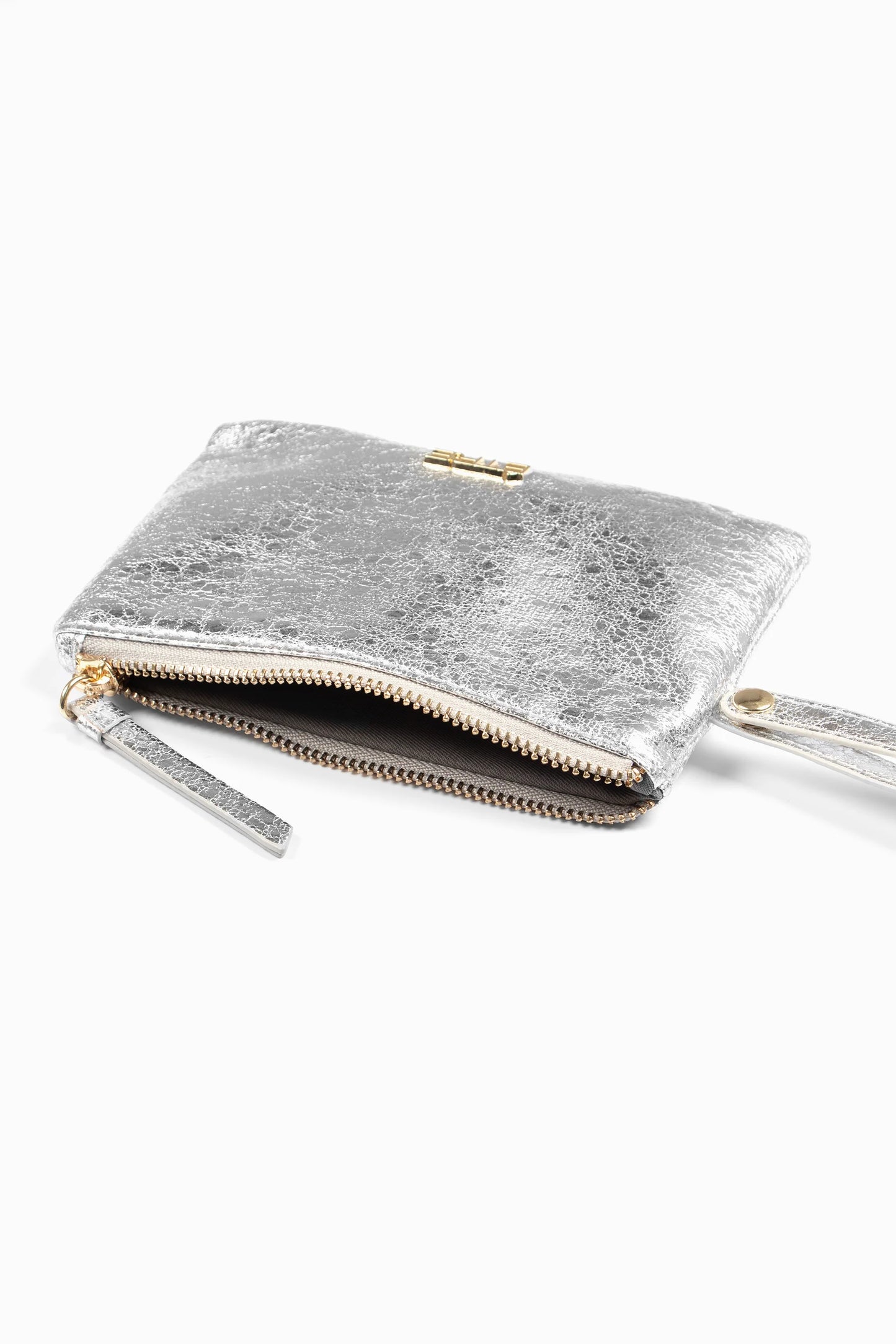 A small, metallic faux leather wristlet purse with a zip fastening and wrist strap is partially unzipped to reveal a dark interior, shown against a white background.