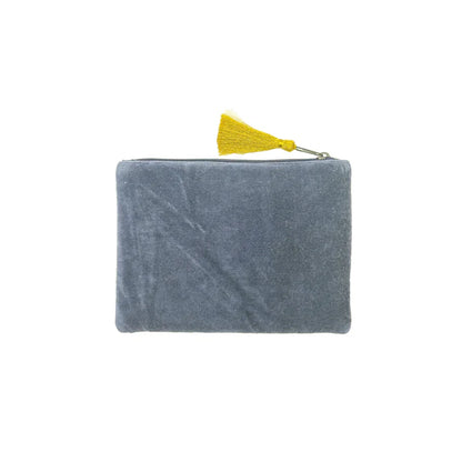 A rectangular grey velvet pouch with a zip fastening and yellow tassel, set against a white background—this vegan-friendly bag makes a stylish Christmas present.