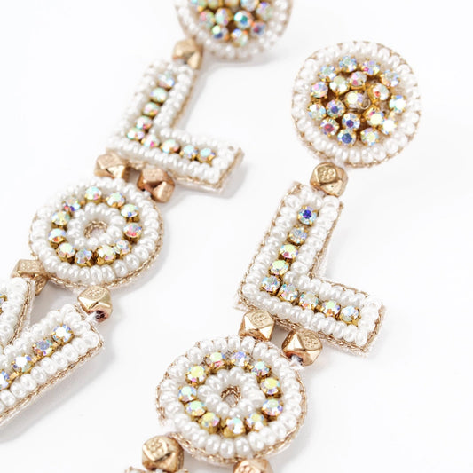Discover the Pearl Glitzy Love Drop Earrings, where beaded craftsmanship spells LOL with sparkling embellishments and pearl-like accents, adding a touch of whimsy to these unique hand-crafted earrings.