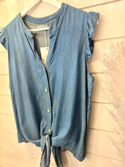 A blue, eco-friendly shirt crafted from vegan materials displayed on a mannequin.