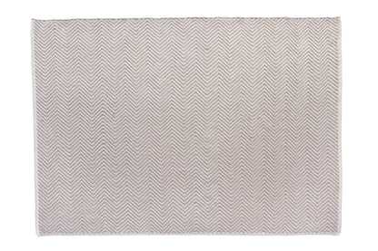 A square beige rug featuring a diagonal chevron pattern, crafted from recycled plastic bottles for sustainability, displayed on a crisp white backdrop.