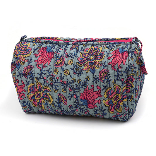 Rectangular quilted make-up bag with a blue background and a colourful floral pattern in pink, yellow, and navy, featuring a zip fastening on the top.