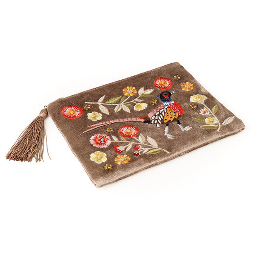 Brown velvet zipped purse with a gold tassel, adorned with colourful embroidered flowers and a bird, lying on a white background.