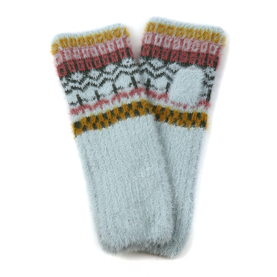 A pair of fluffy knitted socks with a pale blue base and a cosy, multi-patterned design in yellow, pink, black, and white near the top—the perfect addition to your collection of cosy accessories.