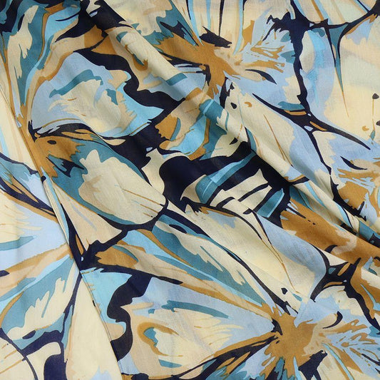 Close-up of a vegan-friendly scarf featuring an abstract floral pattern in hues of blue, yellow, beige, and black, draped to display its texture and folds—an ideal lightweight summer accessory.