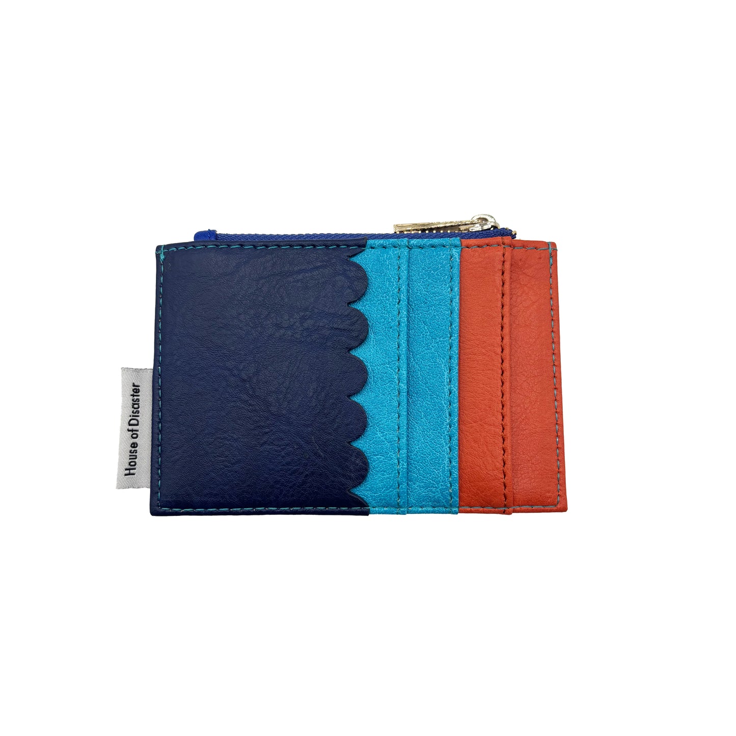 A compact Coral Crab Zip Purse cardholder featuring navy, turquoise and orange panels, scalloped edge detail, a zipped pocket, and a House of Glover fabric label on the left side.