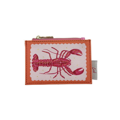 A small orange Coral Lobster Zip Purse featuring a pink illustration of a lobster on the front and a white tag on the side—ideal as a compact zip purse for your essentials.