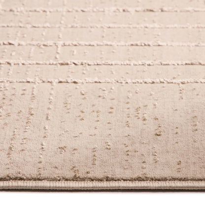 Close-up of the Calacatta Lines Natural Rug, a contemporary polyester rug in beige with a subtle grid design, featuring raised lines and a soft, plush surface.
