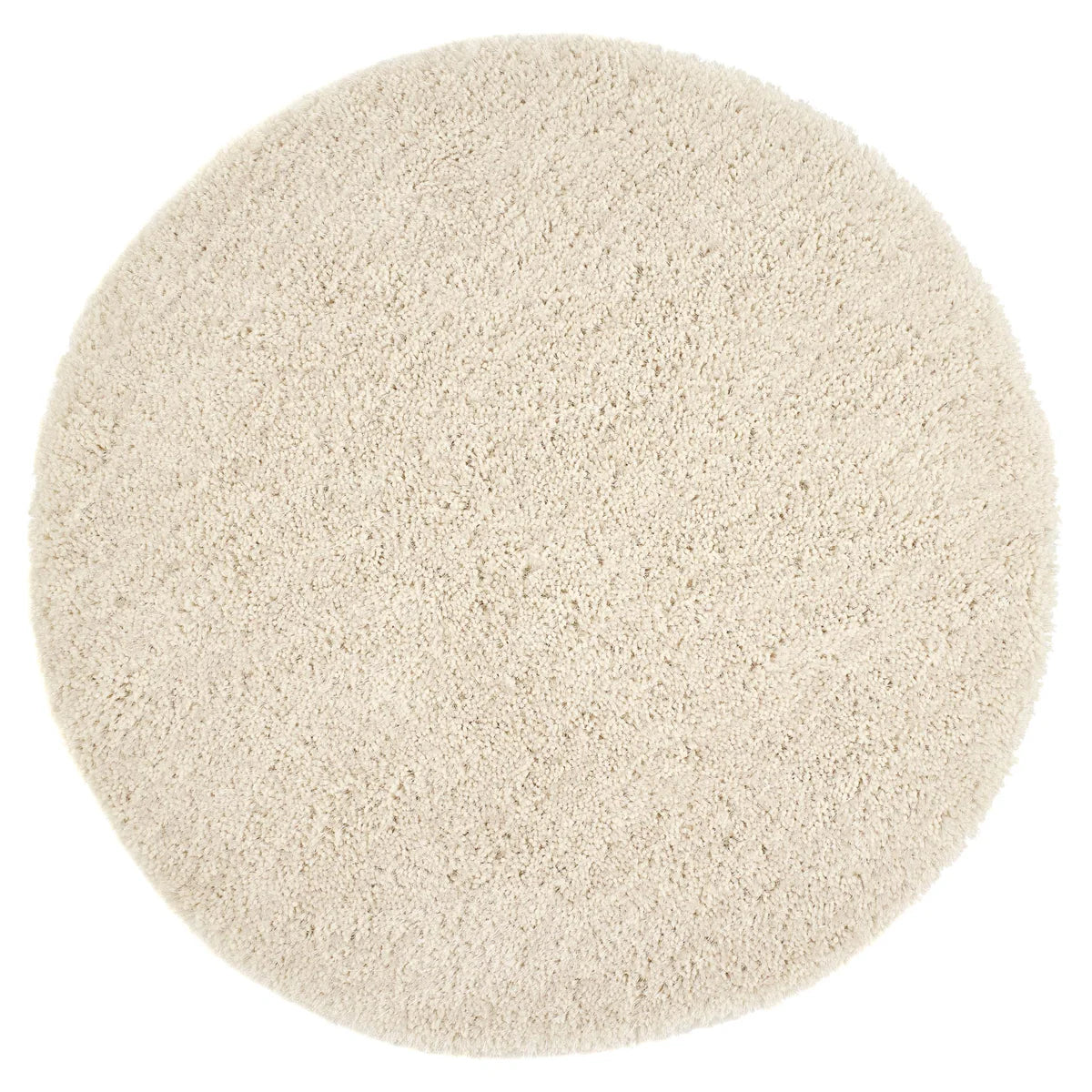 A circular, beige, hand-tufted shaggy pile rug seen from above against a white background.