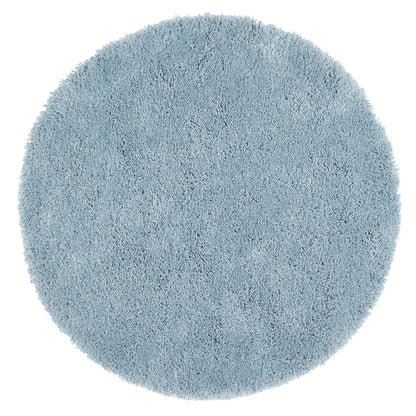 A round, light blue shag pile rug with a thick, soft texture is displayed against a white background.
