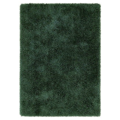 A rectangular, dark green hand-tufted rug with a thick, plush shaggy texture, viewed from above.