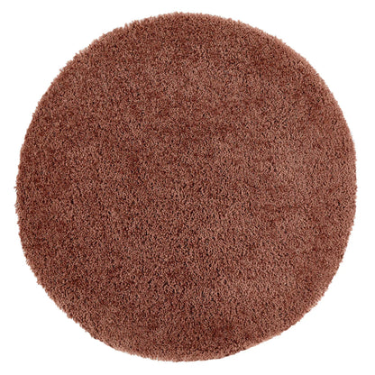 A round, brown Chicago rug with a shaggy texture is photographed from above against a white background.