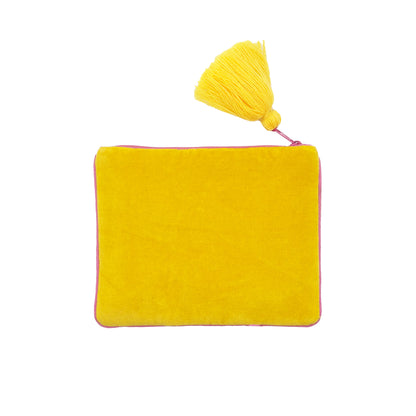 Rectangular yellow velvet handbag with a zip fastening and a large yellow tassel affixed to the top corner, photographed against a white background—a quirky dog purse ideal for those with bold taste in style.