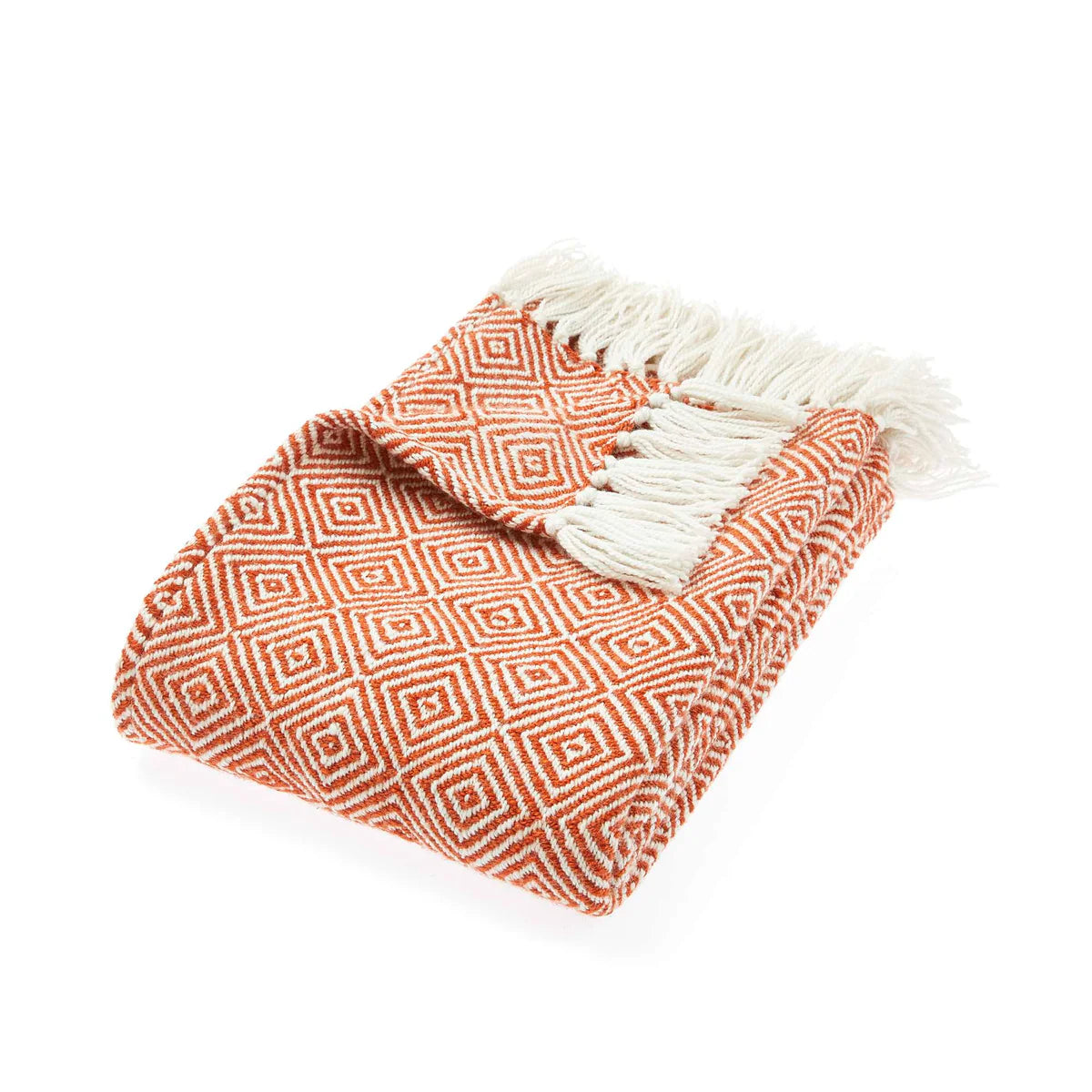 A folded orange and white sustainable throw, made from recycled plastic bottles, featuring a geometric diamond pattern and fringed edges, displayed against a white background.