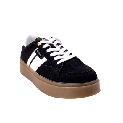 A black suede vegan trainer featuring white laces, white side stripes, and a thick brown rubber sole.
