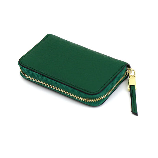 An emerald green faux leather coin purse with a gold-tone zip and pull tab, shown closed against a white background—both stylish and vegan-friendly.