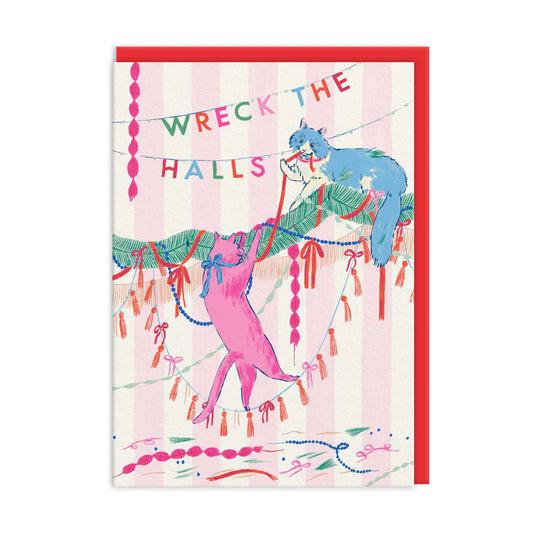 Illustration of two cats tangled in festive decorations beneath a banner reading Wreck the Halls, set against a pink and white striped background; an ideal Christmas card for cat lovers.