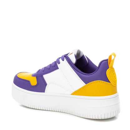 A trainer featuring a white sole, white midsection, purple laces and trim, and yellow accents on the toe and heel—these vegan leather trainers combine style with cruelty-free comfort.