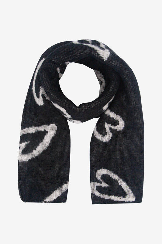 A black vegan heart scarf with a white abstract heart pattern, displayed in a loose loop on a plain background—a cruelty-free accessory suitable for any wardrobe.
