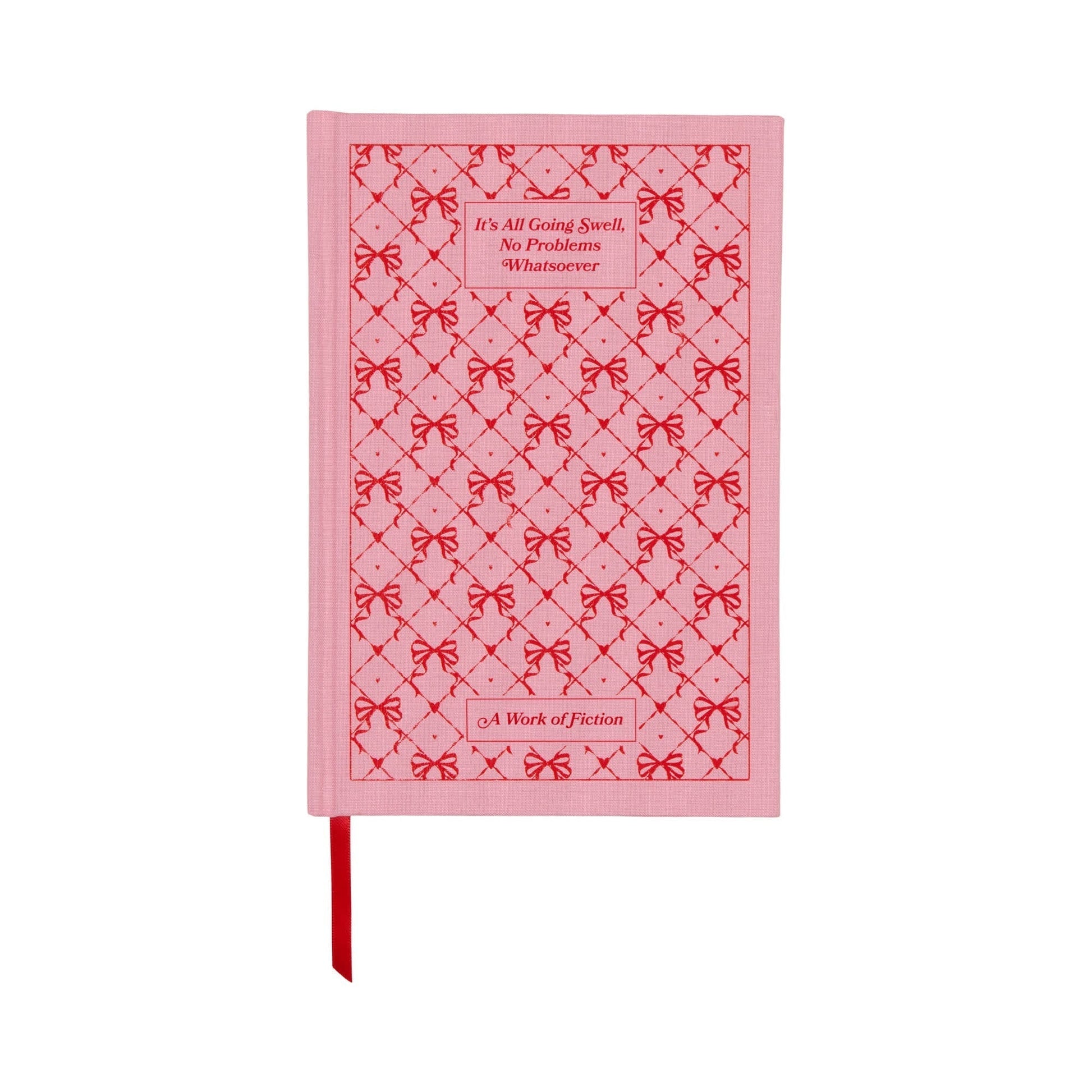 A vintage, book-inspired notebook with a pink hard cover, red bow design, and ribbon bookmark. The cover reads: “It’s All Going Swell, No Problems #vibescore. A Work of Fiction.”.