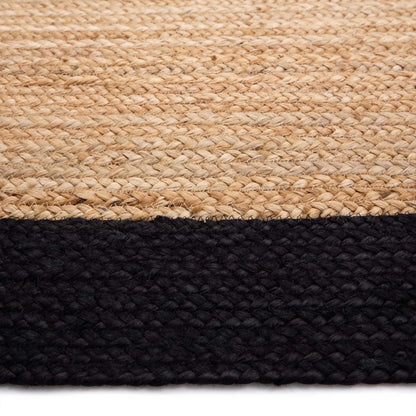 A close-up of an eco-friendly flooring option—a woven jute rug featuring a natural beige section at the top and a solid black border along the bottom.
